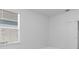 Neutral bedroom with window for natural light and closet with sliding doors at 1599 Laurel Brook Ln, Port Charlotte, FL 33953
