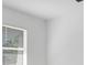 Bright bedroom featuring a window with blinds and view of the outdoors at 1599 Laurel Brook Ln, Port Charlotte, FL 33953