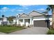 Charming single-Gathering home with a two-car garage, beautiful landscaping, and modern design at 1599 Laurel Brook Ln, Port Charlotte, FL 33953