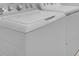 A modern, white front loading washing machine and dryer set for convenient laundry at 1599 Laurel Brook Ln, Port Charlotte, FL 33953