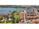 An aerial view of a multi-Gathering condo complex with a tennis court and boat docks at 1624 Stickney Point Rd # 24-206, Sarasota, FL 34231
