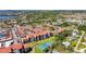 An aerial view of a large multi-Gathering condo complex with a tennis court and a swimming pool at 1624 Stickney Point Rd # 24-206, Sarasota, FL 34231