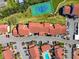 Aerial view of condo complex showcasing tennis court, swimming pool and ample parking at 1624 Stickney Point Rd # 24-206, Sarasota, FL 34231