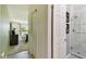 Bright bathroom featuring tile flooring, glass shower, and stylish decor at 1624 Stickney Point Rd # 24-206, Sarasota, FL 34231