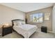 Cozy bedroom features a large window and neutral decor at 1624 Stickney Point Rd # 24-206, Sarasota, FL 34231