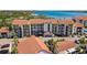 An aerial view of a multi-Gathering condo complex with balconies and mature landscaping at 1624 Stickney Point Rd # 24-206, Sarasota, FL 34231