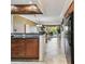 Cozy kitchen featuring black appliances, wooden cabinets, and granite countertops at 1624 Stickney Point Rd # 24-206, Sarasota, FL 34231