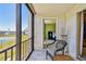 View from screened lanai showing seating area and view into the home at 1624 Stickney Point Rd # 24-206, Sarasota, FL 34231