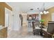 Open concept living and dining area with kitchen view in the background at 1624 Stickney Point Rd # 24-206, Sarasota, FL 34231