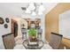 Living room with a view to the kitchen and breakfast bar seating area at 1624 Stickney Point Rd # 24-206, Sarasota, FL 34231