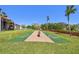 Community shuffleboard courts with green playing surface surrounded by manicured lawn at 1624 Stickney Point Rd # 24-206, Sarasota, FL 34231