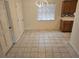Dining area featuring tile floors, neutral walls, and modern light fixture at 1805 9Th W St, Palmetto, FL 34221
