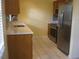 Bright kitchen with stainless steel refrigerator and appliances, and modern cabinets at 1805 9Th W St, Palmetto, FL 34221