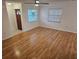 Bright living room featuring wood floors and natural light from two windows at 1805 9Th W St, Palmetto, FL 34221