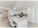 Spacious kitchen island with pendant lights, stainless steel appliances, and ample storage at 18114 Gawthrop Dr # 306, Bradenton, FL 34211