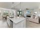 Open-concept kitchen flows into a comfortable living area with a fireplace and outdoor views at 18114 Gawthrop Dr # 306, Bradenton, FL 34211