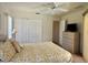 Bedroom featuring a large closet, neutral colors and a ceiling fan at 18513 Placid Ave, Port Charlotte, FL 33948