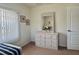 Bedroom showcasing a dresser, window, and closet at 18513 Placid Ave, Port Charlotte, FL 33948