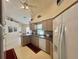 Open kitchen featuring neutral cabinetry, a double sink, and stainless steel appliances at 18513 Placid Ave, Port Charlotte, FL 33948
