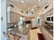 Spacious kitchen with neutral cabinets, stainless appliances, and an island with bar seating at 18513 Placid Ave, Port Charlotte, FL 33948