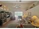 Spacious living room with large windows overlooking the pool, offering a seamless indoor-outdoor living experience at 18513 Placid Ave, Port Charlotte, FL 33948