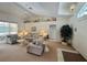 Inviting living room with neutral tones, vaulted ceiling, and an abundance of natural light at 18513 Placid Ave, Port Charlotte, FL 33948