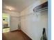 Empty walk-in closet with plenty of shelf storage space for a customized storage solution at 18513 Placid Ave, Port Charlotte, FL 33948