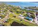 Panoramic aerial view of beautiful waterfront neighborhood, showcasing lush landscaping and community charm at 206 Bedford St, Oldsmar, FL 34677