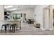 Open-concept dining area with skylights, a kitchen island, and seamless access to outdoor living at 206 Bedford St, Oldsmar, FL 34677