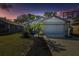 Charming single-story home with a two-car garage, well-manicured lawn, and a basketball hoop at 206 Bedford St, Oldsmar, FL 34677