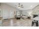 Inviting living room with natural light, comfortable seating, and an open flow to the kitchen at 206 Bedford St, Oldsmar, FL 34677
