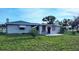 Charming backyard with a well-maintained lawn and cozy back patio at 22116 26Th E Ave, Bradenton, FL 34211