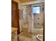 Cozy bathroom featuring neutral tilework, a shower-tub combo, and storage space at 22116 26Th E Ave, Bradenton, FL 34211