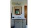 This full bathroom has a vanity with ample counter space, a large mirror, and vanity storage at 22116 26Th E Ave, Bradenton, FL 34211
