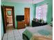 Well-lit bedroom with a full bath, and closet with shutter doors at 22116 26Th E Ave, Bradenton, FL 34211