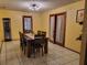 Spacious dining room with tile floors, a dark wood table, and natural light at 22116 26Th E Ave, Bradenton, FL 34211