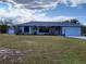 Charming single-story home with a two-car garage, stone accents, and a well-maintained lawn at 22116 26Th E Ave, Bradenton, FL 34211