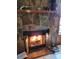 Inviting stone fireplace with glass doors creates a cozy and warm atmosphere at 22116 26Th E Ave, Bradenton, FL 34211