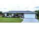 Charming single-story home featuring a well-manicured lawn and attached two car garage at 22116 26Th E Ave, Bradenton, FL 34211