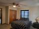Comfortable main bedroom with a ceiling fan, plush carpeting, and ample closet space at 22116 26Th E Ave, Bradenton, FL 34211
