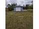 Outdoor shed for storage in a spacious yard, great for tools and gardening supplies at 22116 26Th E Ave, Bradenton, FL 34211