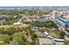 Aerial view of Payne Park, showing a playground, pond, tennis courts, and the downtown skyline at 2344 Lindstrom St, Sarasota, FL 34237