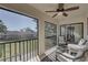 Relaxing screened balcony with comfortable seating and a view of the community at 2825 74Th W St, Bradenton, FL 34209