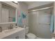 Bathroom featuring white vanity, updated fixtures, toilet, and glass enclosed shower at 2825 74Th W St, Bradenton, FL 34209