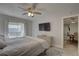 Bright primary bedroom features a ceiling fan, ensuite bathroom, and walk-in closet at 2825 74Th W St, Bradenton, FL 34209