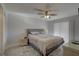 Bedroom featuring a ceiling fan, ensuite bathroom, and walk-in closet at 2825 74Th W St, Bradenton, FL 34209
