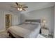 Bright primary bedroom featuring a ceiling fan, ensuite bathroom, and walk-in closet at 2825 74Th W St, Bradenton, FL 34209