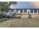 Exterior view of condo unit with a fenced-in patio and well-manicured lawn at 2825 74Th W St, Bradenton, FL 34209
