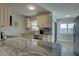 Updated kitchen featuring granite counters, stainless appliances, and light, bright cabinets at 2825 74Th W St, Bradenton, FL 34209