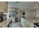 Kitchen featuring granite countertops, stainless steel appliances, and updated cabinetry at 2825 74Th W St, Bradenton, FL 34209